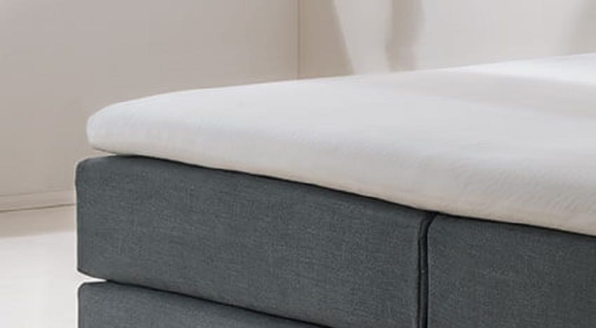 RUF Betten TKS-Topper auf einem Bett im Schlafzimmer