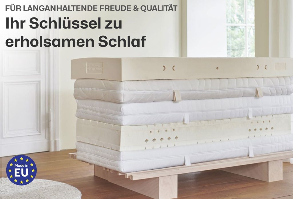 Latextopper Natura-LUX auf einem Bett im Schlafzimmer