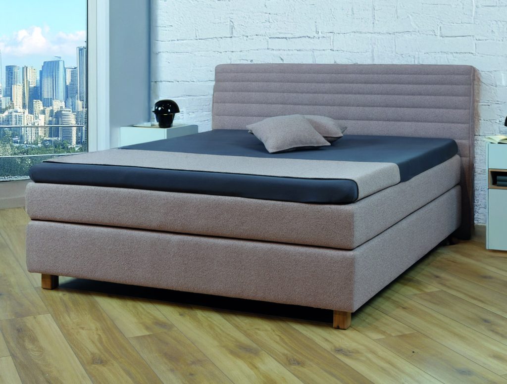 hülsta Boxspringbett Cuello in Rosé mit gestepptem Kopfteil und Holzfüßen