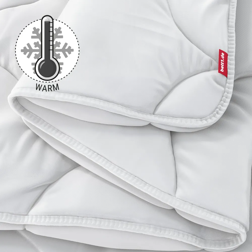bett1 BODYGUARD Winterdecke warm – Nahaufnahme der Steppung mit Wärmegrad-Symbol